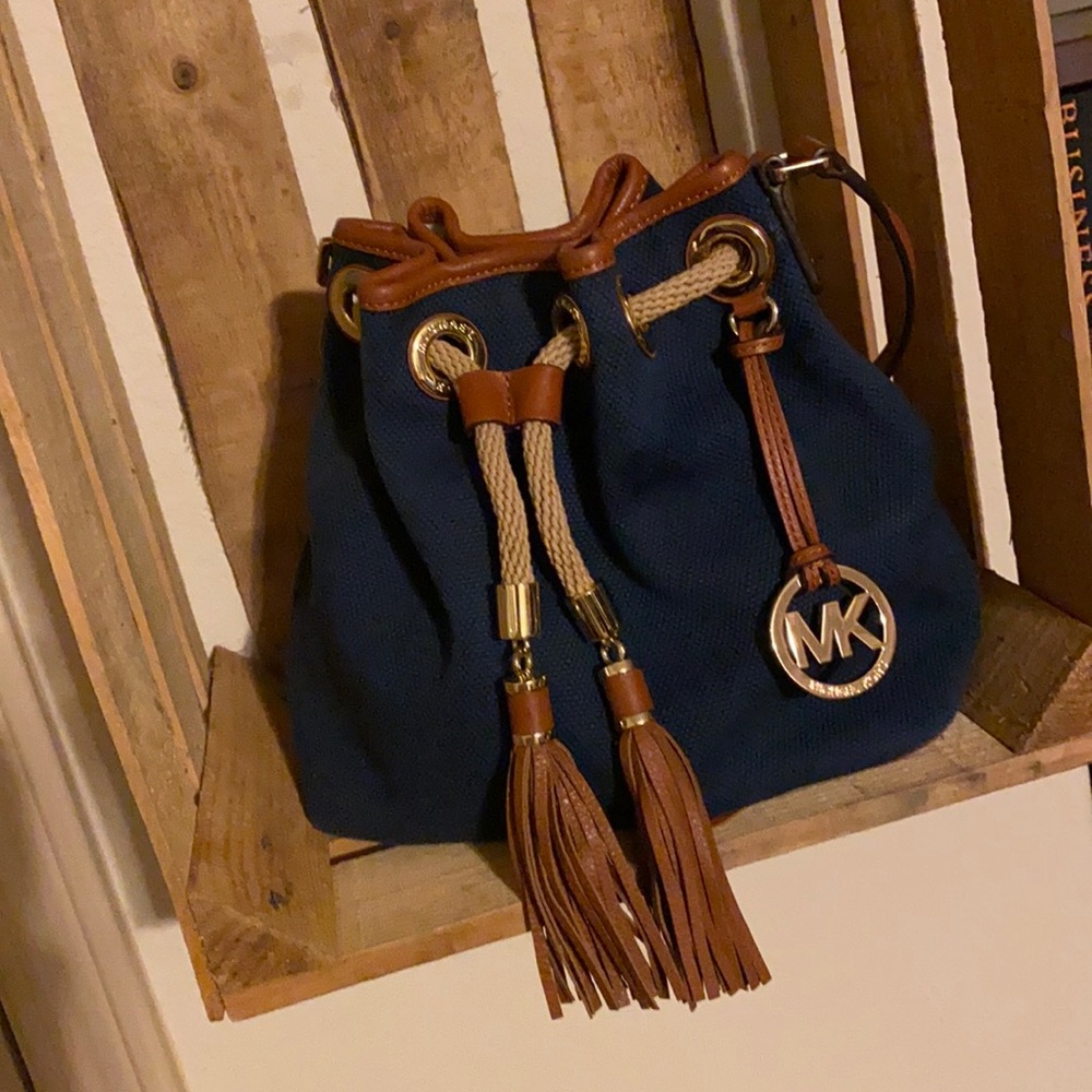 Navy blue and brown leather handbag